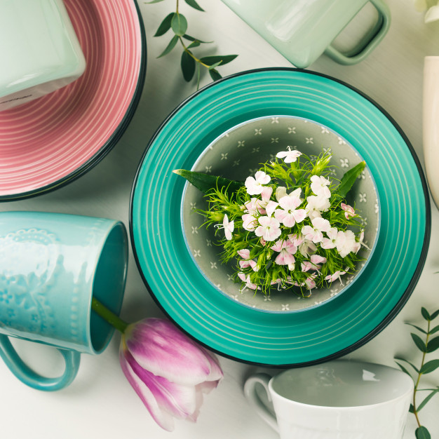 spring-crockery-concept-with-tulips-flowers-pastel-color_89418-925